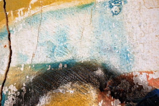 Detail of a cracked paint stained wall.