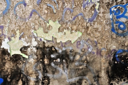 Old peeling grunge wall covered with messy graffiti and mold. Background texture.