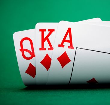 playing cards on a green table casino