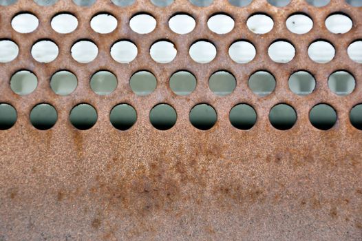 Rusty circles surface. Industrial grill metal background texture.