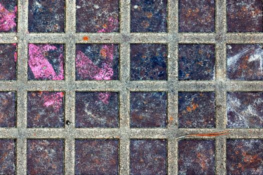 Rusty metal squares stained surface. Industrial background texture.