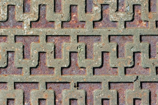 Rusty industrial metal surface with abstract pattern.