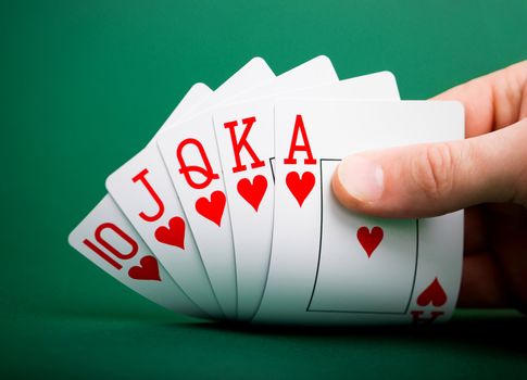 playing cards on a green table casino