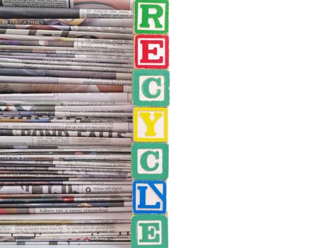 A Pile of Newspapers with the Word RECYCLE in Alpahbet Blacks