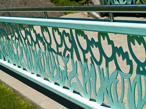 An Ornanate Flowery Stair Railing in an Outdoor Park