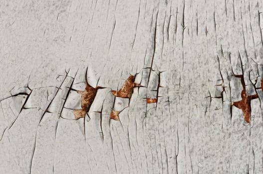 White cracked peeling paint grungy background texture.