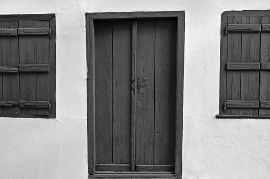 Door and wooden window shutters. Black and white