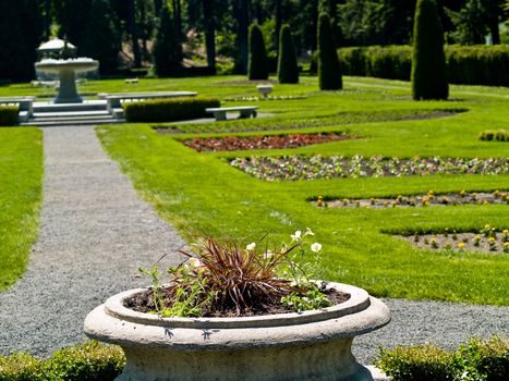 A Well Groomed Park in Early Spring with a Paved Path