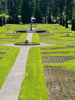 A Well Groomed Park in Early Spring with a Paved Path