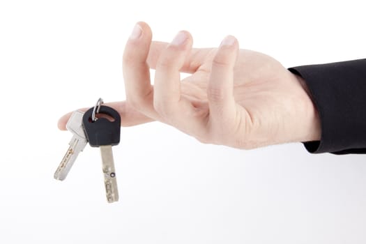 hand with keys isolated on white background