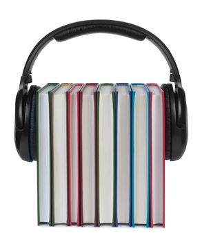 Headphones on books isolated white background. Concept of e-learning and listening to audiobooks.