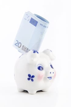 piggy bank with euro isolated on white