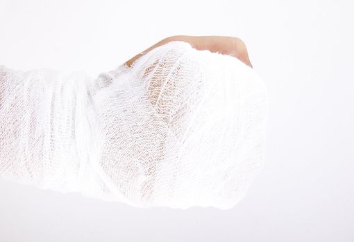 A horizontal image of a men's bandaged hand