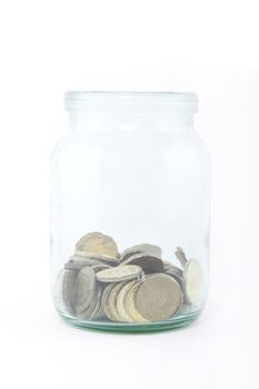 coins in glass savings or tips bottle