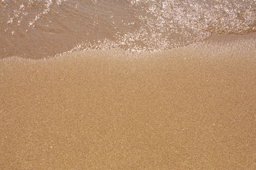 Sand and water on the beach.