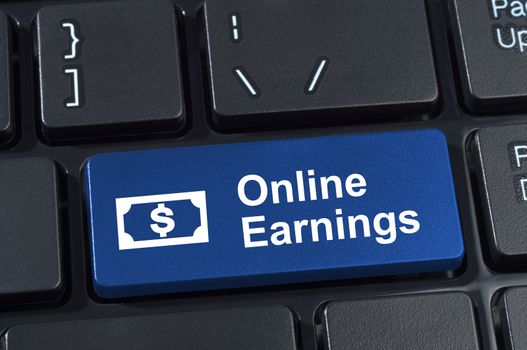 Online earnings computer keyboard button. Concept of earnings money with Internet technology.