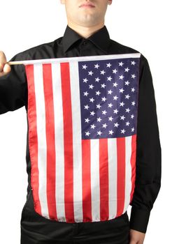 Businessman in black suit holding a flag of the USA