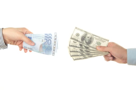 Hands holding euro and dollar bills on white