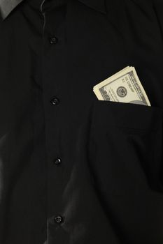 Dollars in pocket of coat background or texture