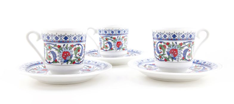 Ornamented teacups isolated on white background for site