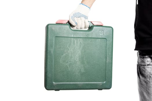 Green tool box in workers hand isolated