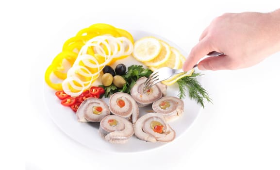 taste fresh fish with begetables and olives isolated