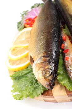 fish with lemon on plate isolaten on white