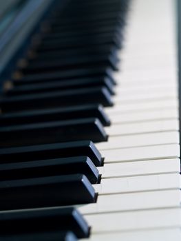 Piano keys of a very well loved and often played piano 