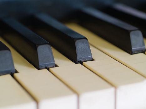 Piano keys of a very well loved and often played piano