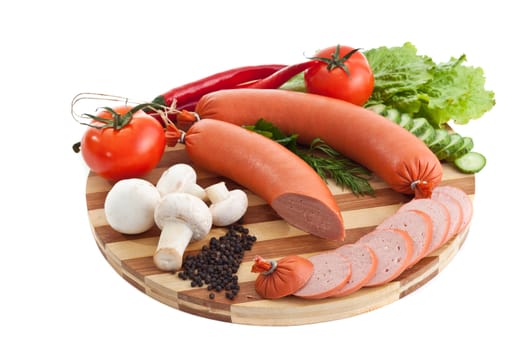 sausage on plate with vegetables isolated on white