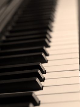 Piano keys of a very well loved and often played piano in Sepia