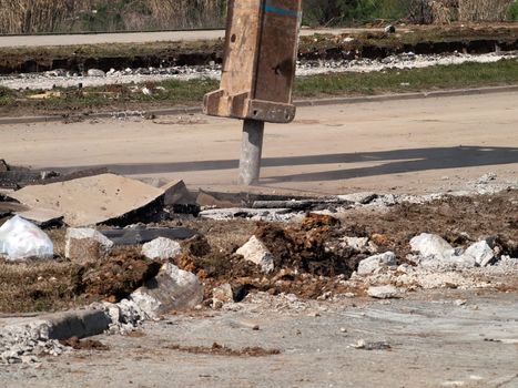 hydraulic arm of jackhammer on building site