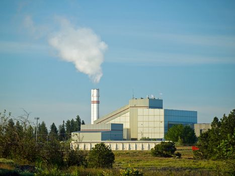 Waste to Energy Plant with Smoke Coming Out of a Smokestack 