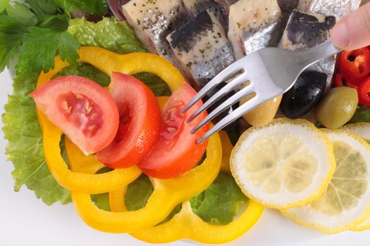 fish with vegetables,anion red pepper close up