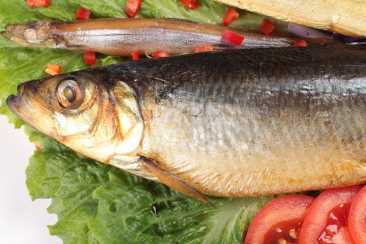 fish on plate with red pepper close up