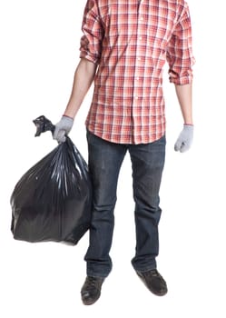 Man holding black plastic trash bag in his hand isolated