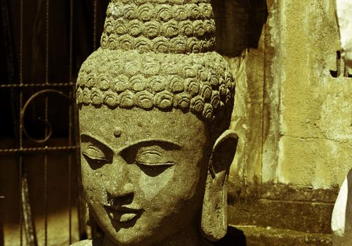 Traditional Balinese god statue in front of the temple