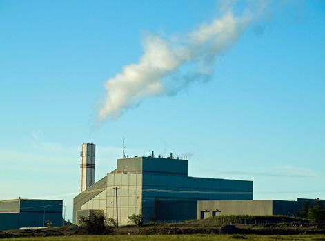 Waste to Energy Plant with Smoke Coming Out of a Smokestack