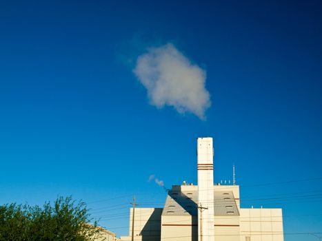 Waste to Energy Plant with Smoke Coming Out of a Smokestack 