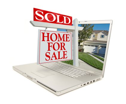 Sold Home for Sale Sign & New Home on Laptop isolated on a white Background.