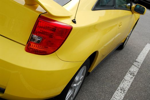 Yellow sports car, rear view