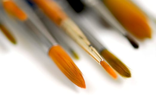 Macro of paintbrushes on white background