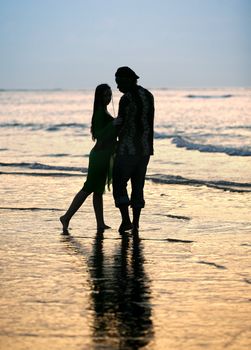 Couple on sunset. Coast of the Indian ocean