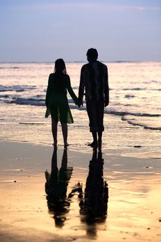 Couple on sunset. Coast of the Indian ocean