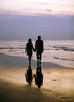 Couple on sunset. Coast of the Indian ocean