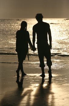 Couple on sunset. Coast of the Indian ocean