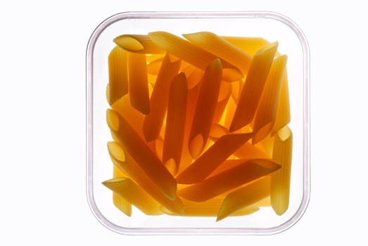 Raw pasta in glass jar with clipping path - backlit