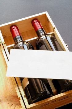 Wood gift box with two wine bottles and blank card (vertical)