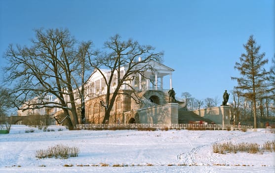 Classical gallery building with sculptures and stairway