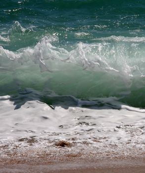 Big wave crashes on to the shore